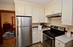 Full kitchen with coffee maker, toaster, dishwasher and microwave